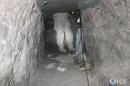 In this image released by the US Immigration and Customs Enforcement (ICE) on April 4, 2014, an ICE officer stands at the exit of a suspected drug smuggling tunnel on April 3, in Otay Mesa, south of San Diego, California