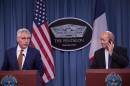 US Defense Secretary Chuck Hagel (L) and French Defense Minister Jean-Yves Le Drian hold a press conference following talks at the Pentagon in Washington on October 2, 2014