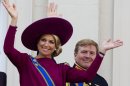 FILE - In his Sept. 18, 1012 file photo Princess Maxima, left, and Crown Prince Willem Alexander, wave to well wishers from the balcony of Royal Palace Noordeinde in The Hague, Netherlands. Prince Willem-Alexander's ascension to the Dutch throne in April 2013 promises to be a shining moment on the world stage for his wife Maxima and her home country of Argentina. But there will be a glaring absence at the ceremony. Queen Beatrix's announcement this week that she'll step aside and let her son become king raised new questions about the future queen's father, Jorge Zorreguieta, one of the longest-serving civilian ministers in Argentina's 1976-1983 military dictatorship.(AP Photo/Vincent Jannink, file)