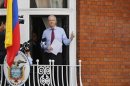 Wikileaks founder Julian Assange gestures as he appears to speak from the balcony of Ecuador's embassy in London