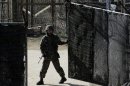 A South Korean soldier closes a military gate in Paju, north of Seoul, South Korea, Sunday, April 7, 2013. A top South Korean national security official said Sunday that North Korea may be setting the stage for a missile test or another provocative act with its warning that it soon will be unable to guarantee diplomats' safety in Pyongyang. But he added that the North's clearest objective is to extract concessions from Washington and Seoul. (AP Photo/Lee Jin-man)