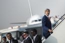US Secretary of State John Kerry boards his plane at Cairo International Airport on September 13, 2014