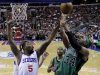 Boston Celtics' Paul Pierce, right, goes up for a shot as Philadelphia 76ers' Arnett Moultrie defends in the first half of an NBA basketball game, Friday, Dec. 7, 2012, in Philadelphia. (AP Photo/Matt Slocum)