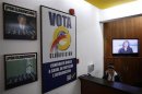 A poster with picture of former U.S. President George W. Bush hangs on wall of looby of TV station Globovision in Caracas
