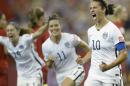 United States' Carli Lloyd (10) celebrates with teammates Ali Krieger (11) and Morgan Brian after scoring on a penalty kick against Germany during the second half of a semifinal in the Women's World Cup soccer tournament, Tuesday, June 30, 2015, in Montreal, Canada. (Ryan Remiorz/The Canadian Press via AP)