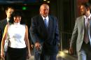 FILE - In this July 22, 2014 file photo former Minnesota Gov. Jesse Ventura, center, arrives at court with his wife, Terry, and others for his defamation lawsuit against "American Sniper" author Chris Kyle in St. Paul, Minn. Kyle wrote in his best-seller that he decked Ventura in a California bar in 2006 after Ventura allegedly said Navy SEALs "deserve to lose a few." Ventura, a former SEAL and pro wrestler, testified Kyle fabricated the story. Kyle denied that in testimony videotaped before his death last year. (AP Photo/The Star Tribune, Jim Gehrz, File) MANDATORY CREDIT; ST. PAUL PIONEER PRESS OUT; MAGS OUT; TWIN CITIES LOCAL TELEVISION OUT