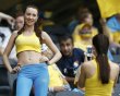 Ukrainian soccer fan smiles as she waits for the start of the Group D Euro 2012 soccer match against France at Donbass Arena in Donetsk