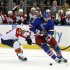 CORRECTS ID TO RICK NASH- Florida Panthers' Scottie Upshall (19) battles for the puck against New York Rangers' Rick Nash during the second period of an NHL hockey game Thursday, April 18, 2013 at Madison Square Garden in New York. (AP Photo/Mary Altaffer)