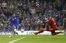 Chelsea's Cesc Fabregas scores the opening goal against Schalke's goalkeeper Ralf Faehrmann during the Champions League Group G soccer match between Chelsea and Schalke 04 at Stamford Bridge stadium in London Wednesday, Sept. 17, 2014. (AP Photo/Kirsty Wigglesworth)