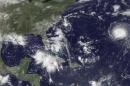 Handout photo of satellite image of three storm systems shown in the Atlantic Ocean