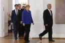 German President Gauck and German Chancellor Merkel Economy Minister Roesler and Foreign Minister Westerwelle arrive for ceremony at Bellevue Castle in Berlin
