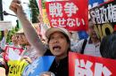 Hundreds of protesters gather outside the prime minister's official residence in Tokyo on May 14, 2015 as the government approves a set of security bills bolstering the role of the military