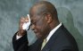 Republican presidential candidate Herman Cain wipes his brow during remarks to legislators in the Congressional Health Care Caucus on Capitol Hill in Washington