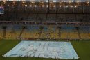 A banner with the Pope's photo is displayed on the field of the Maracana stadium before a soccer game between Brazilian teams Fluminense and Vasco da Gama in Rio de Janeiro