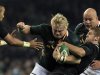 South Africa's Strauss is challenged by Ireland's Zebo and Henry in international rugby union match in Dublin