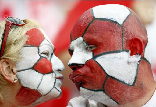 Polish soccer fans wait for the start of their Group A Euro 2012 soccer match against Greece at the National Stadium in Warsaw