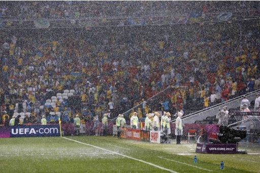 Heavy rain falls as the match is suspended during the Euro 2012 soccer championship Group D match between Ukraine and France in Donetsk, Ukraine, Friday, June 15, 2012. (AP Photo/Matthias Schrader)