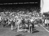 FILE - This is an April 15, 1989 file photo of fans on the pitch receiving attention after severe crushing at Hillsborough stadium in Sheffield England during an FA Cup semi-final football match between Liverpool and Nottingham Forest.  A London court Wednesday Dec. 19, 2012  has overturned a previous ruling that the death of 96 Liverpool fans in the 1989 Hillsborough disaster was accidental, and a new criminal investigation into the stadium tragedy was ordered. The wrongdoing and mistakes that led to the crush at an FA Cup semifinal against Nottingham Forest were only fully exposed in September after an independent panel examined previously secret documents, vindicating a 23-year search for the truth by the victims' families. (AP Photo/PA, File) UNITED KINGDOM OUT