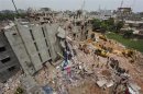 A view of rescue workers attempting to find survivors from the rubble of the collapsed Rana Plaza building in Savar