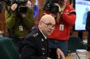 Royal Canadian Mounted Police Commissioner Bob Paulson speaks, Friday, March 6, 2015, in Ottawa, Ontario, at the Commons Public Safety committee to publicly display and discuss the video Michael Zehaf-Bibeau filmed just prior to his shooting rampage last October on Parliament Hill. (AP Photo/The Canadian Press, Fred Chartrand)