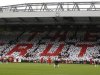 Supporters hold up coloured cards in memory of the victims of the Hillsborough disaster at Anfield in Liverpool