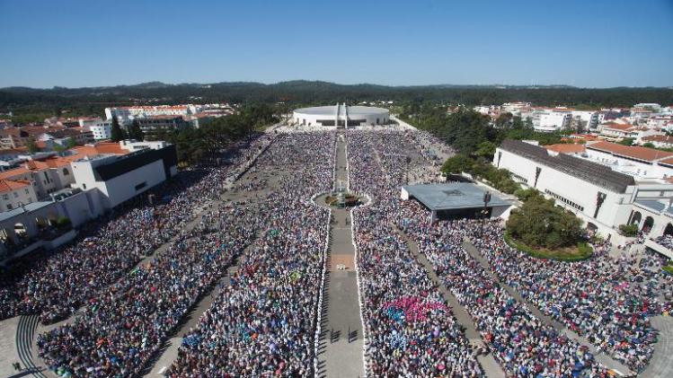 Pilgrims attend a mass at the Fatima shrine in Fatima, central Portugal, on May 13, 2013