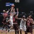Brooklyn Nets Kris Humphries shoots between Chicago Bulls Taj Gibson and Luol Deng in NBA game in New York