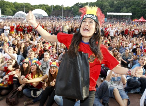 Spanish fans react during the first match of the Euro 2012 played by their team against Italy at the fan zone in Gdansk