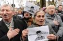 Activists sing the Ukrainian anthem in front of the Russian consulate in Lviv, western Ukraine, during a rally in support of jailed Ukrainian pilot Nadiya Savchenko