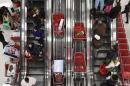 Shoppers ride an escalator at a Target Store in Chicago