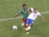 Cameroon's Jean Makoun fights for the ball with Netherlands' Nigel de Jong during a 2010 World Cup Group E soccer match at Green Point stadium