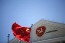 File photo of a Chinese national flag in front of a GlaxoSmithKline office building in Shanghai