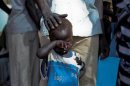 A boy who fled a war across the border in Sudan's Blue Nile state waits in a queue outside a clinic in Doro refugee camp