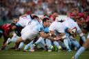Bayonne's Welsh scrum-half Mike Phillips (C) passes the ball during a French Top 14 rugby union match on September 21, 2013 at the Mayol stadium in Toulon, southeastern France
