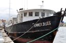 The "Summer Bliss" fishing boat sits docked at the Willemstad port in Curacao, Friday, Nov. 30, 2012. Masked men in jackets emblazoned with the word "police" boarded the "Summer Bliss" in an early morning assault on Friday and stole 70 gold bars worth an estimated $11.5 million, police spokesman Reggie Huggins said. He declined to say who owned the approximately 216 kilograms (476 pounds) of gold but he said it was a legal shipment that was being transshipped through Curacao and officials in the island had been advised in advance that it was coming as part of normal security protocols. (AP Photo/Karen Attiah)