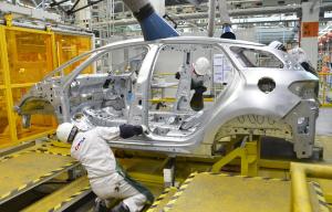 Workers put together a car at a PSA Peugeot Citroen&nbsp;&hellip;