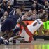 Toronto Raptors Anderson is fouled by Memphis Grizzlies Allen as Grizzlies Conley looks on during the second half of their NBA basketball game in Toronto