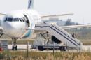 A man believed to be the hijacker of the EgyptAir Airbus A-320, which was diverted to Cyprus, leaves the plane at Larnaca airport on March 29, 2016