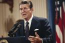 FILE - In this Oct. 19, 1983 file photo, President Ronald Reagan speaks during a news conference at the White House in Washington. President Barack Obama's impending unilateral order awarding legal status to millions of immigrants is not unprecedented. Two of the last three Republican presidents _ Ronald Reagan and George H.W. Bush _ did the same thing in extending amnesty to family members not covered by the last major overhaul of immigration law in 1986. There was no political explosion then comparable to the one Republicans are threatening now. (AP Photo/J. Scott Applewhite, File)