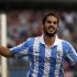 Malaga's Isco celebrates after scoring a goal against Real Betis during their Spanish First Division soccer match at La Rosaleda stadium in Malaga