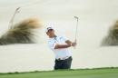 Hideki Matsuyama of Japan hits a shot from a greenside bunker on the third hole during the final round of the Hero World Challenge at Albany, The Bahamas on December 4, 2016