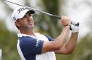 Scott Piercy watches his shot from the seventh tee during the first round of the Cadillac Championship golf tournament, Thursday, March 3, 2016, in Doral, Fla. (AP Photo/ Wilfredo Lee)
