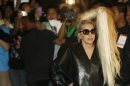 U.S. singer Lady Gaga poses for photographers upon arrival for her concert in Manila