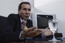 Argentine prosecutor Nisman, who is investigating the 1994 car-bomb attack on the AMIA Jewish community center, speaks during a meeting with journalists at his office in Buenos Aires