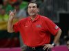 FILE- In this Aug. 4, 2012, file photo, United States coach Mike Krzyzewski signals to players during a preliminary men's basketball game against Lithuania at the 2012 Summer Olympics in London. A person with knowledge of the decision says Krzyzewski has agreed to return as U.S. men's Olympic basketball coach. He was originally expected to step down but instead will attempt to lead the Americans to a third straight gold medal, the person tells The Associated Press on condition of anonymity because no official announcement has been made.  (AP Photo/Eric Gay)