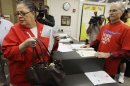 In this June 6, 2012 photo, Chicago Teachers Union President Karen Lewis casts her ballot during a strike authorization vote at a Chicago high school. Angered by Mayor Rahm Emanuel's call for a longer school day and wage and benefit concessions, 25,000 Chicago teachers voted this week to consider authorizing their first strike in a quarter-century. (AP Photo/M. Spencer Green)