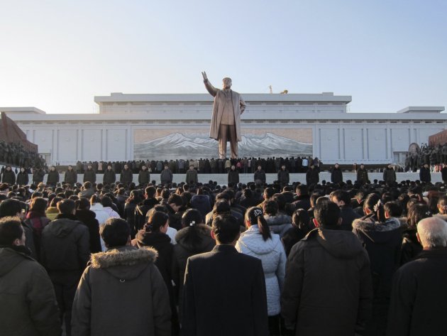 Hundreds of North Koreans gather to mourn the death of their leader Kim Jong Il in front of a giant statue of his father Kim Il Sung in Pyongyang, North Korea, Monday, Dec. 19, 2011. North Korea's new