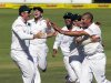 South Africa's Graeme Smith, Dean Elgar, Robin Petersen, Faf du Plessis and Rory Kleinveldt celebrate the wicket of New Zealand's Daniel Flynn on day three of the second cricket test match in Port Elizabet