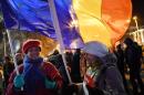 People protest controversial decrees to pardon corrupt politicians in front of the government headquarters in Bucharest on February 3, 2017