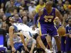 Minnesota Timberwolves' Ricky Rubio left, of Spain, falls to the floor after a called charge on Los Angeles Lakers' Kobe Bryant in the first quarter of an NBA basketball game Friday, Feb. 1, 2013, in Minneapolis. (AP Photo/Jim Mone)